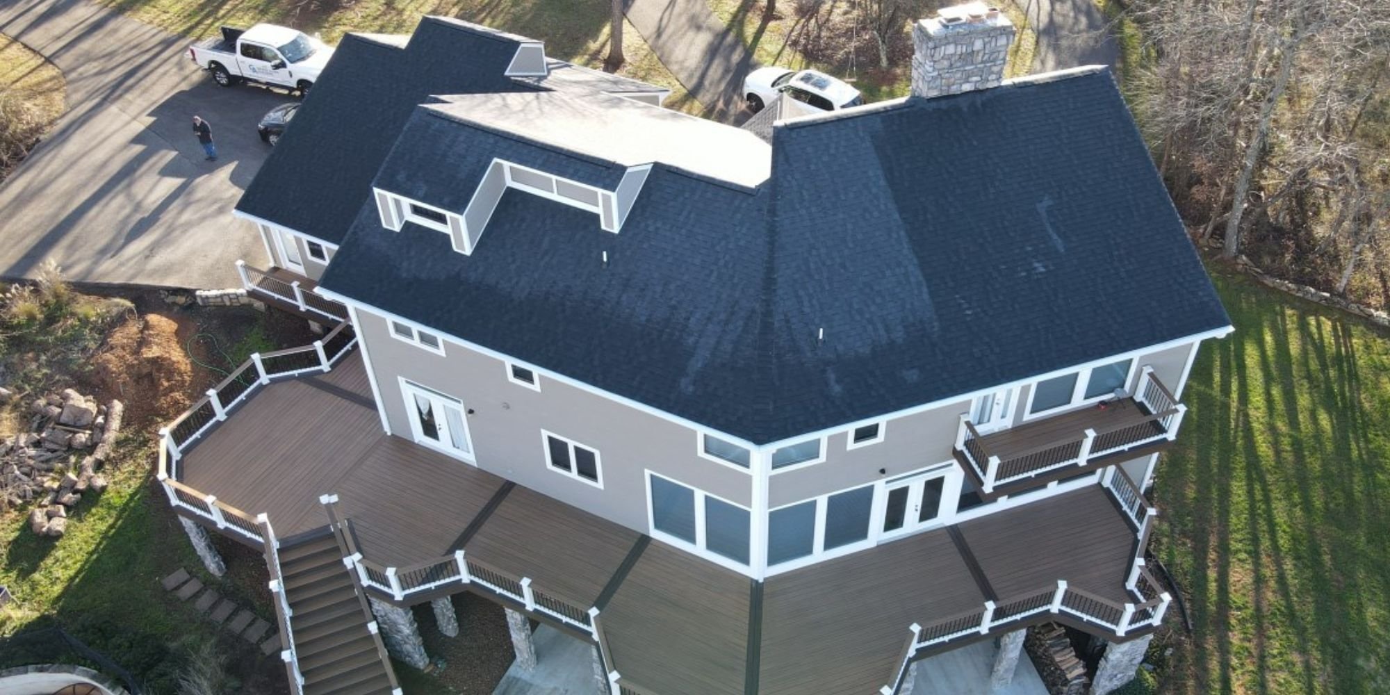Modern custom home with multi-level wraparound deck by Grace Alon in Roanoke, VA