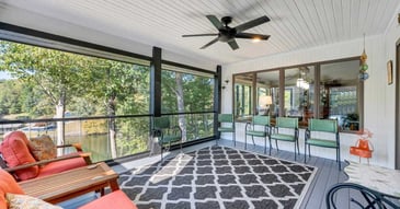 A comfortable outdoor home addition overlooking Smith Mountain Lake by Grace Alon Builders.