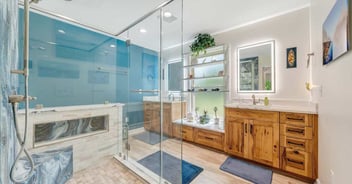 Luxurious primary bathroom in Smith Mountain Lake home by Grace Alon Builders with walk-in shower