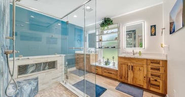 Luxurious primary bathroom in Smith Mountain Lake home by Grace Alon Builders with walk-in shower