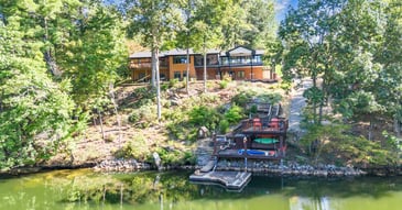Grace Alon Builders home addition in Smith Mountain Lake, VA with lakeside decks, wooded lot, and private dock