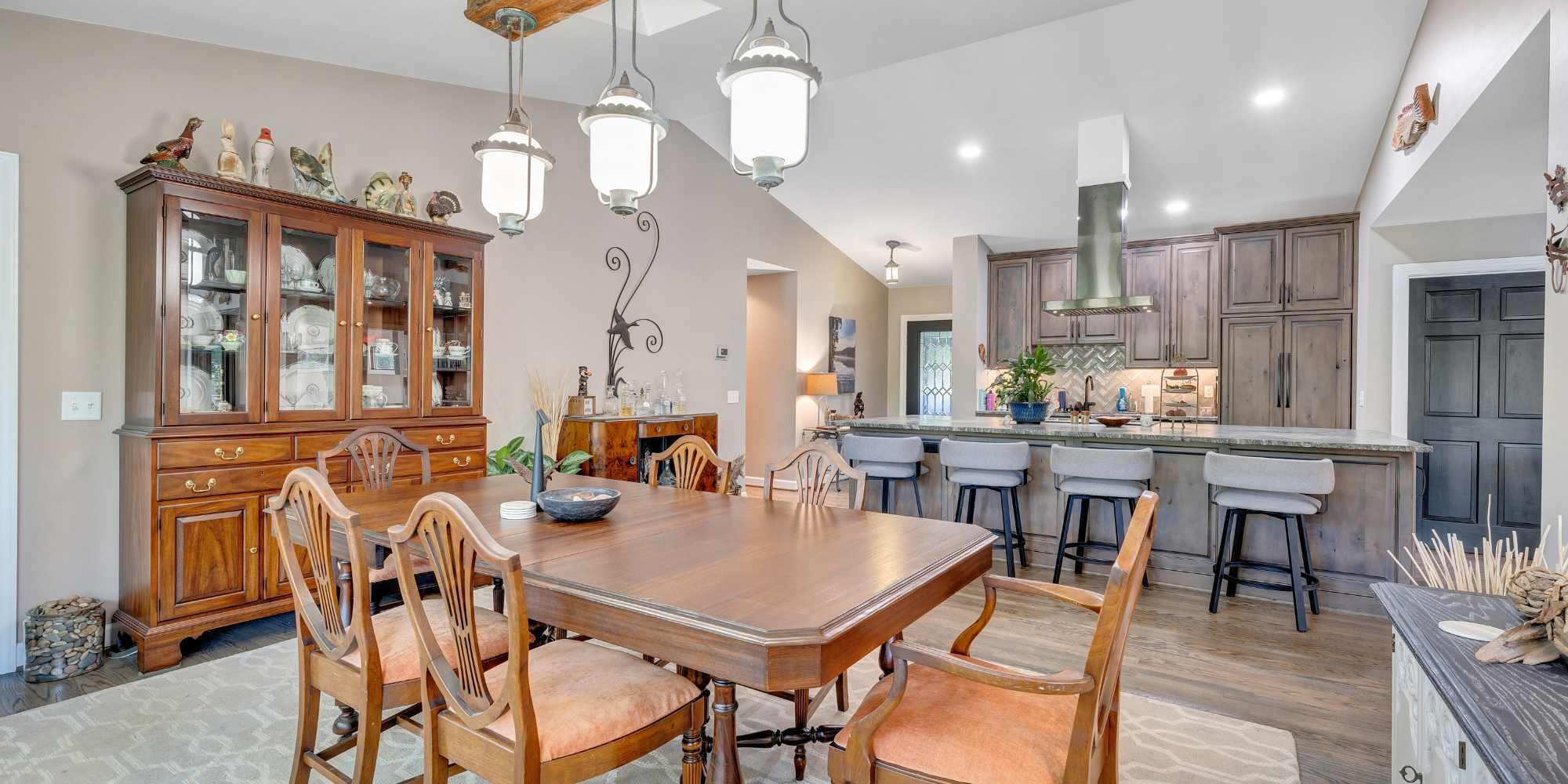 Grace Alon Builders home addition kitchen in Smith Mountain Lake, VA with large island seating and custom cabinetry