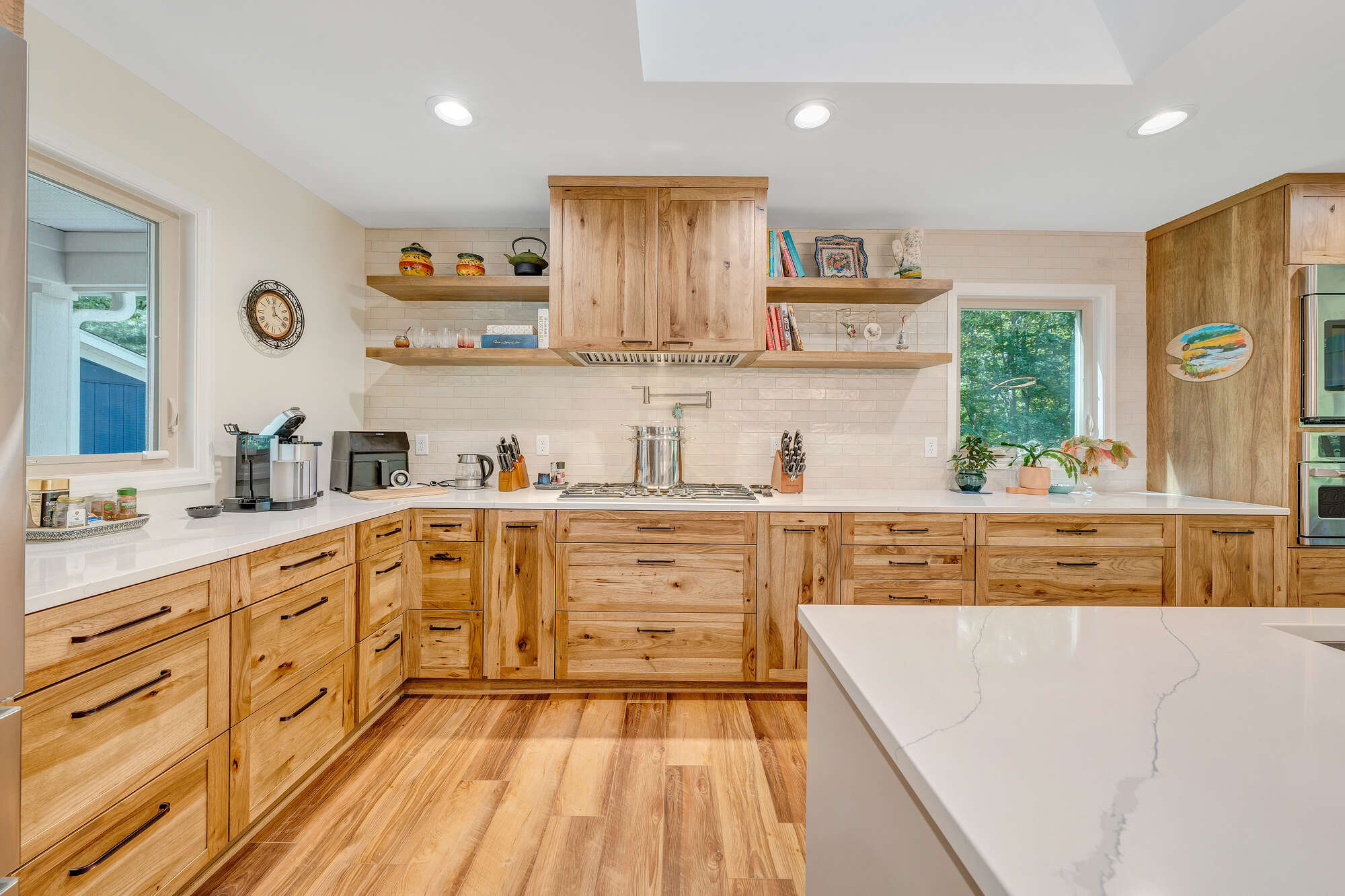 Custom kitchen in Smith Mountain Lake home by Grace Alon Builders with wood cabinetry and quartz countertops