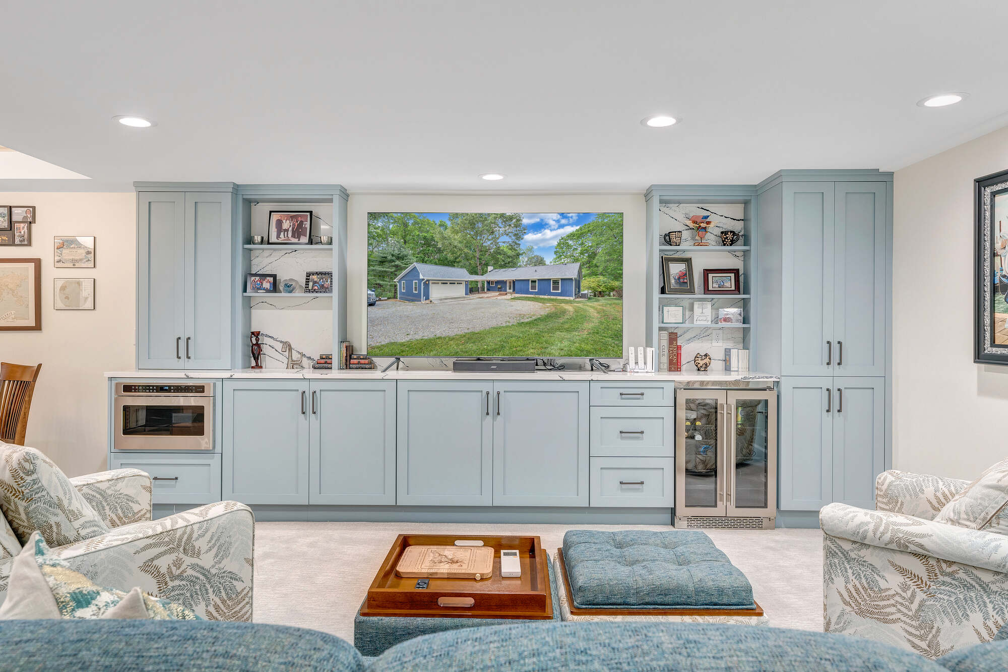 Grace Alon Builders’ custom media room in Smith Mountain Lake home with built-in cabinetry and large screen