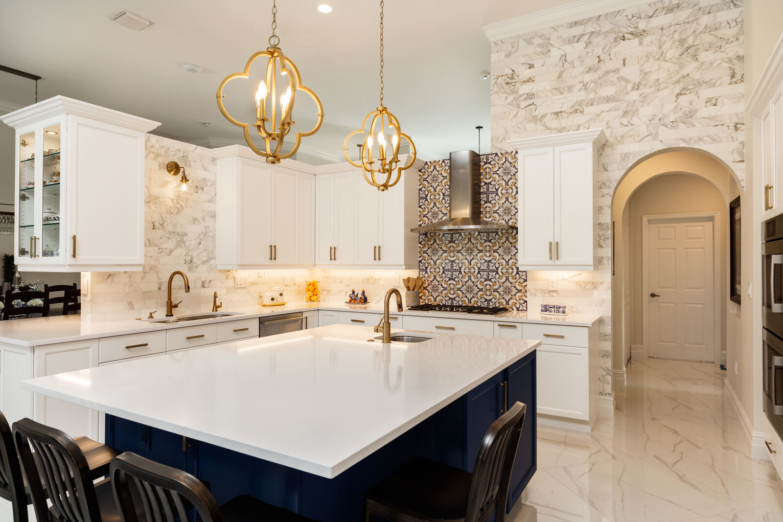 Bold transitional kitchen with navy island and patterned backsplash by Grace Alon Builders in Roanoke County
