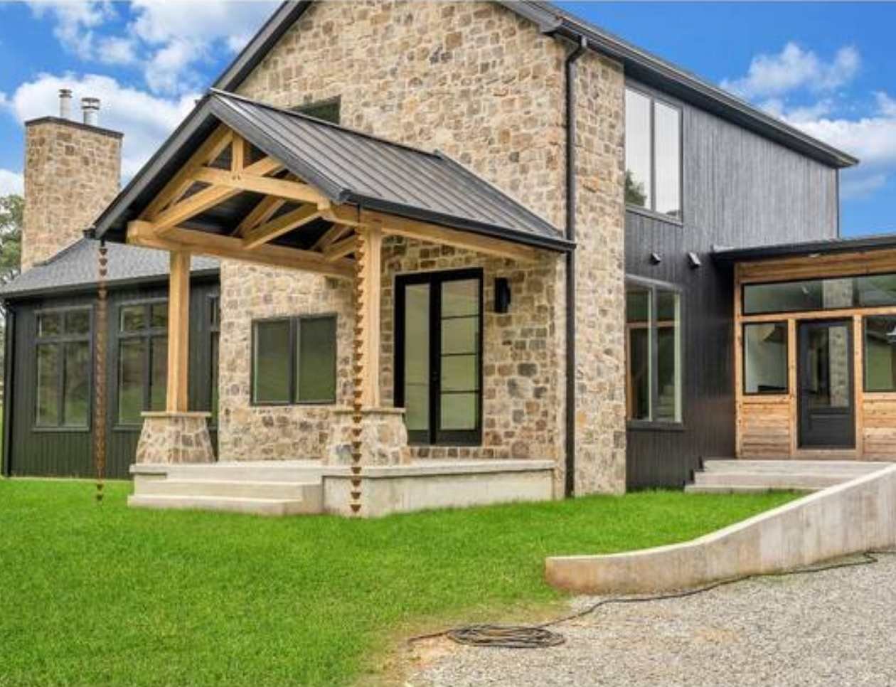 Front view showing the stonework detail on a custom home build by Grace Alon Builders