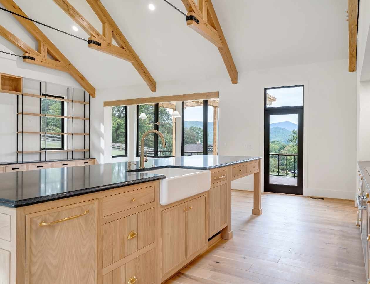 Image of a spacious kitchen with large island in a custom home by Grace Alon Builders in Moneta, VA