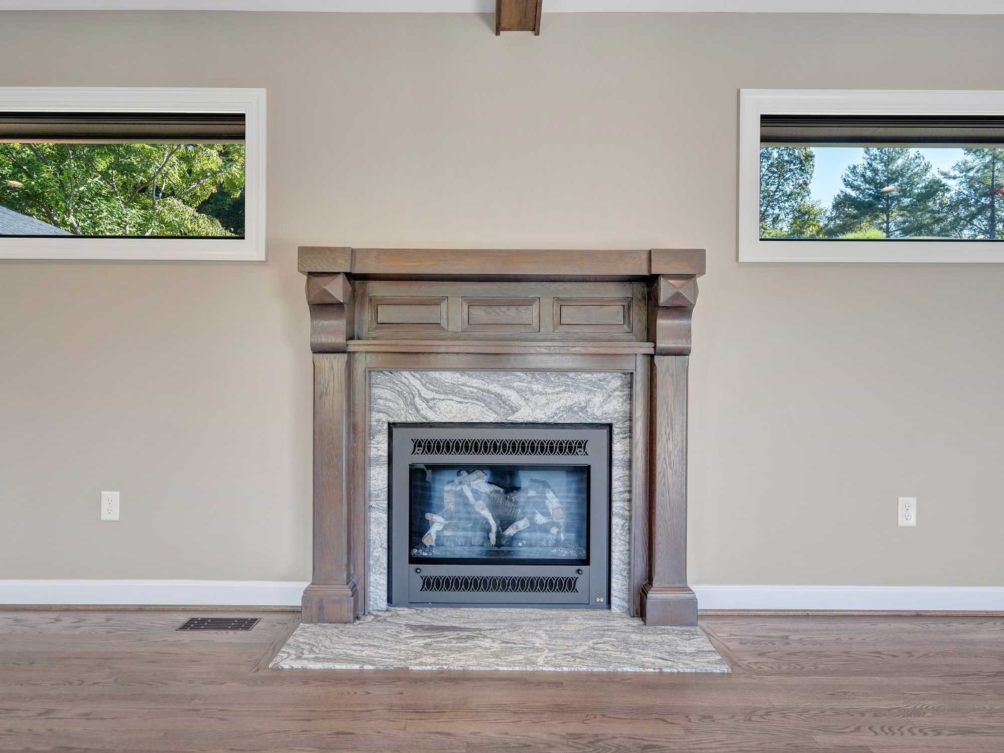 Added a fireplace in the home addition by Grace Alon Builders Added a fireplace in the home addition by Grace Alon Builders