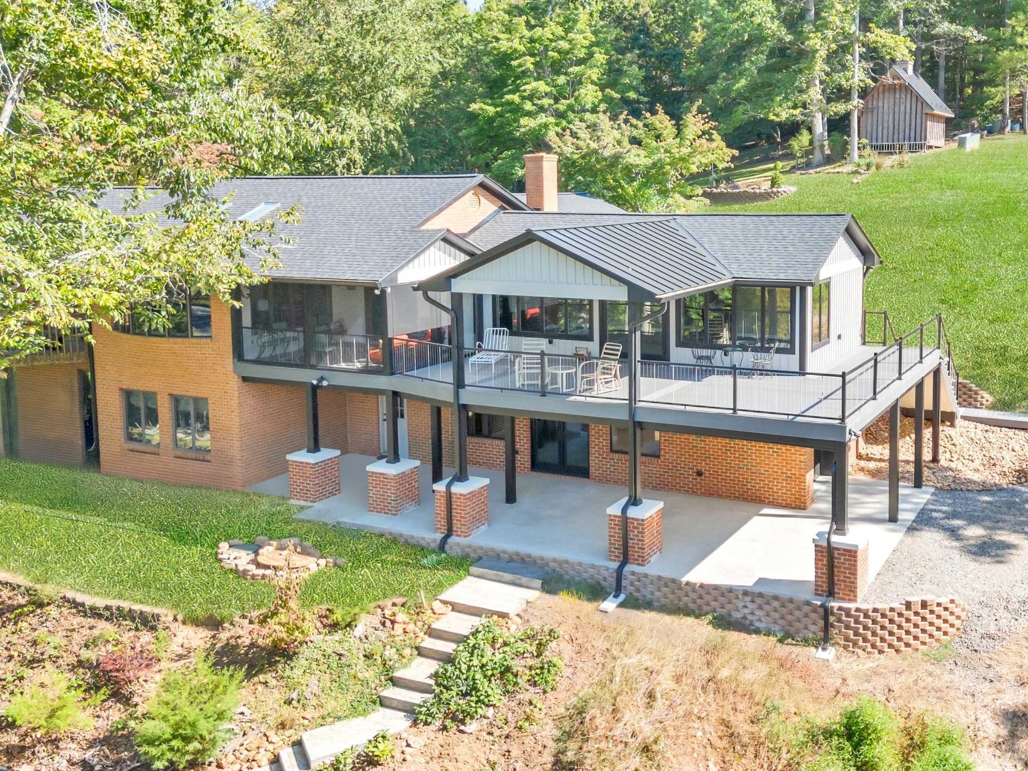 Exterior of two-story home addition by Grace Alon Builders Exterior of two-story home addition by Grace Alon Builders