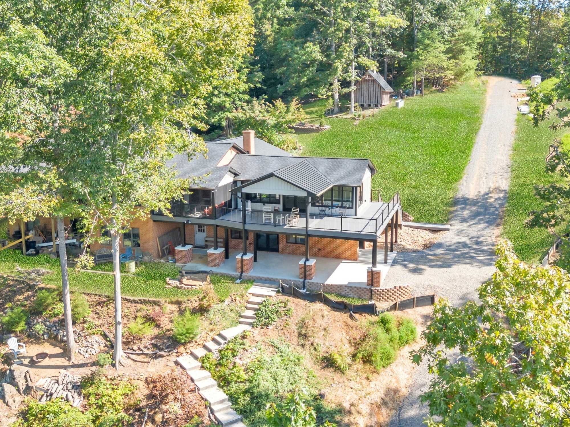 Zoomed out view of the home addition showing landscaping by Grace Alon Builders Zoomed out view of the home addition showing landscaping by Grace Alon Builders