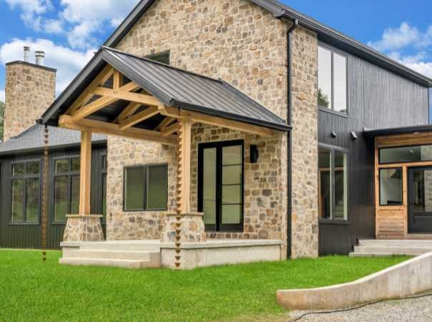 Front view showing the stonework detail on a custom build by Grace Alon Builders