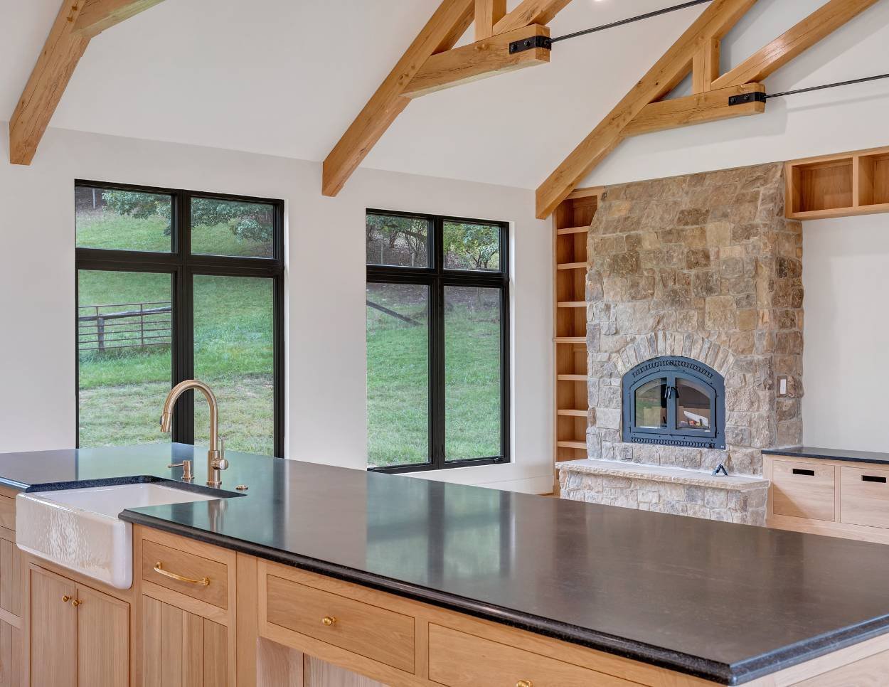 grace-alon-kitchen-fireplace-detail-exposed-trusses-roanoke