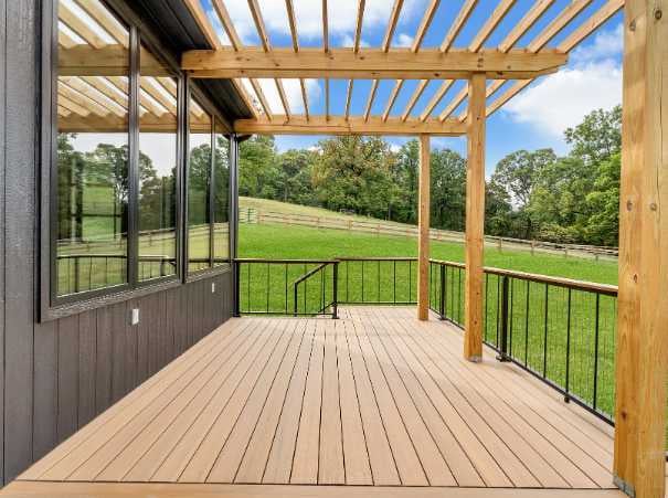 Outdoor deck with pergola overlooking rolling hills, built by Grace Alon Builders