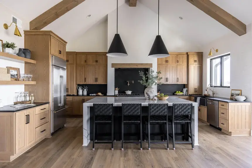 Custom farmhouse-style kitchen in Roanoke County by Grace Alon Builders with wood cabinetry and black accents Custom farmhouse-style kitchen in Roanoke County by Grace Alon Builders with wood cabinetry and black accents