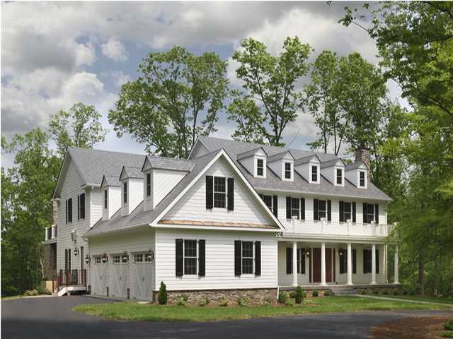 Colonial-style custom home in Roanoke Metropolitan with dormer windows and a three-car garage by Grace Alon Builders