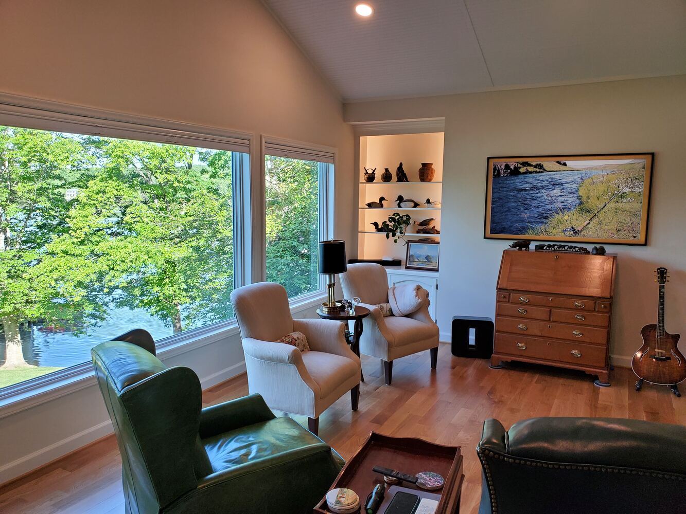 Cozy sitting area with large lakefront windows in a Roanoke Metropolitan custom home by Grace Alon Builders