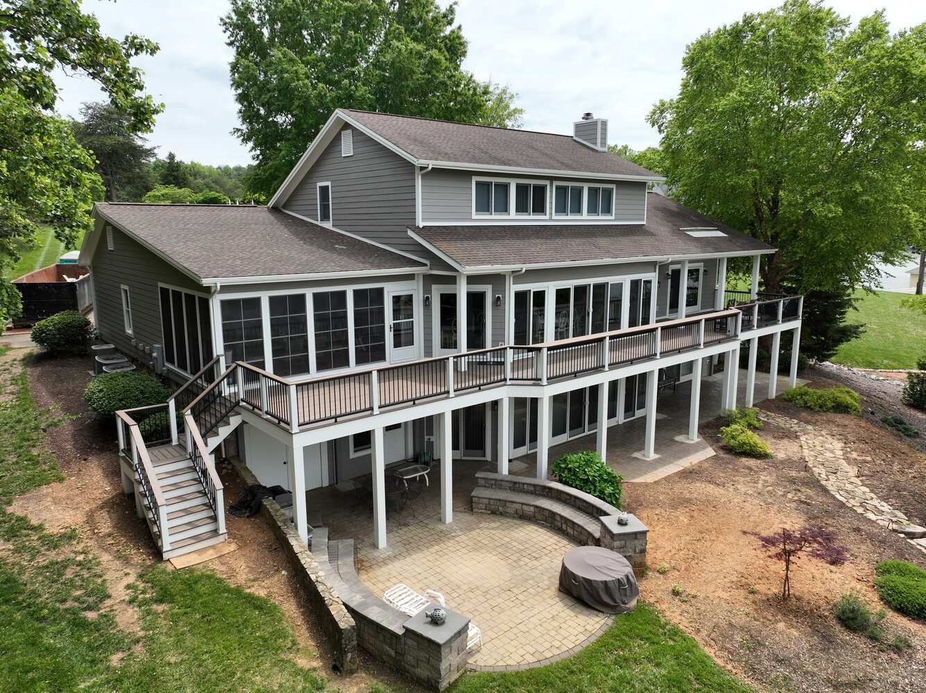 Grace Alon Builders custom home in Roanoke Metropolitan with elevated deck and stone patio