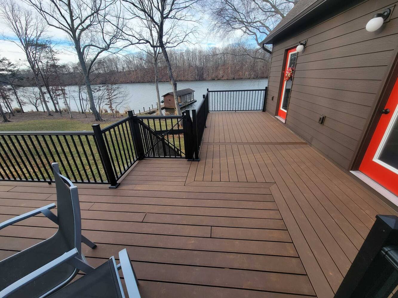 Grace Alon Builders custom lakefront deck with black railings in Roanoke Metropolitan