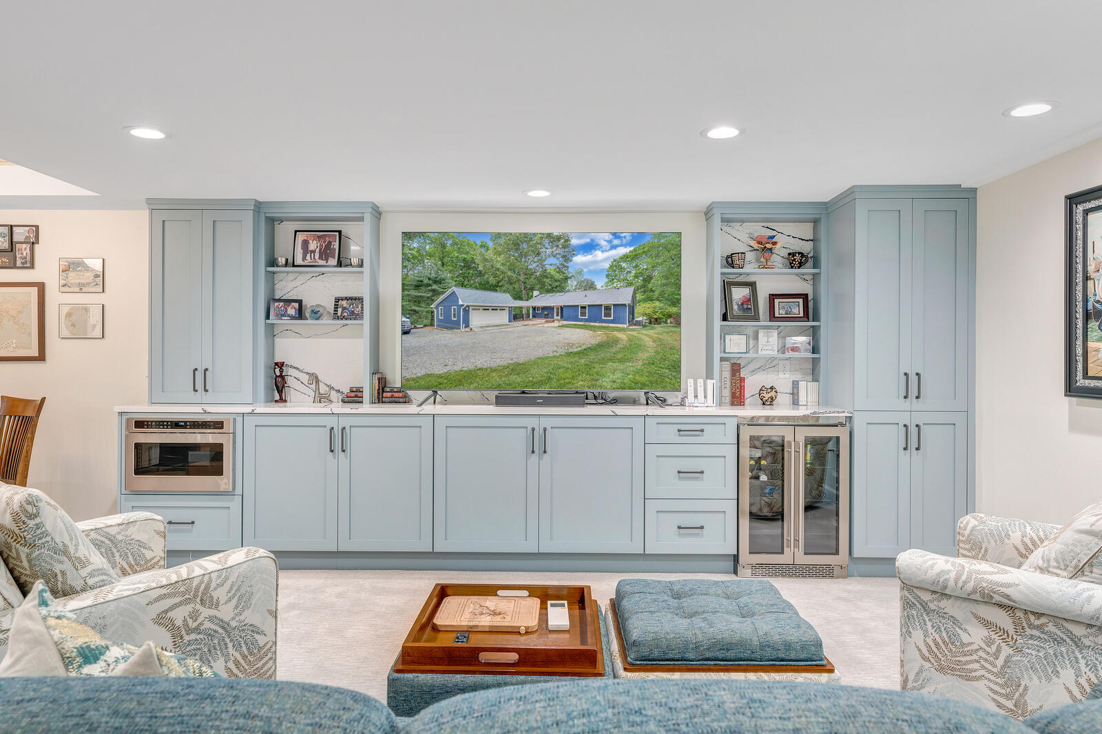 Grace Alon Builders’ custom media room in Smith Mountain Lake home with built-in cabinetry and large screen
