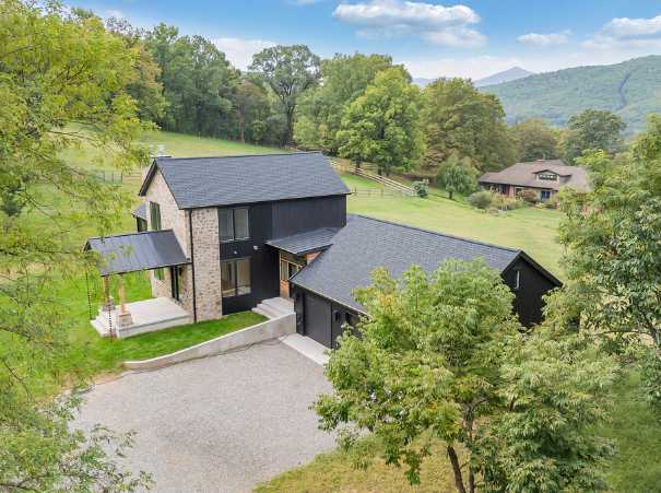 Exterior view of a custom home with attached garage by Grace Alon Builders