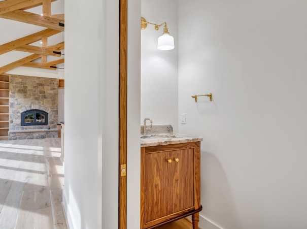 Sink in a half bathroom in a new custom home by Grace Alon
