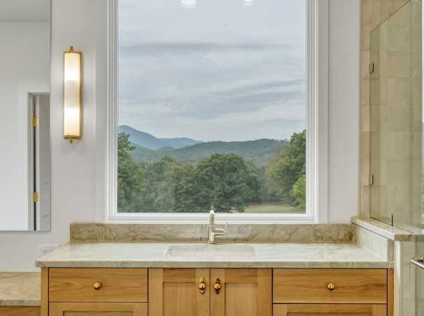 Window view from the primary bathroom in a custom home built by Grace Alon Builders