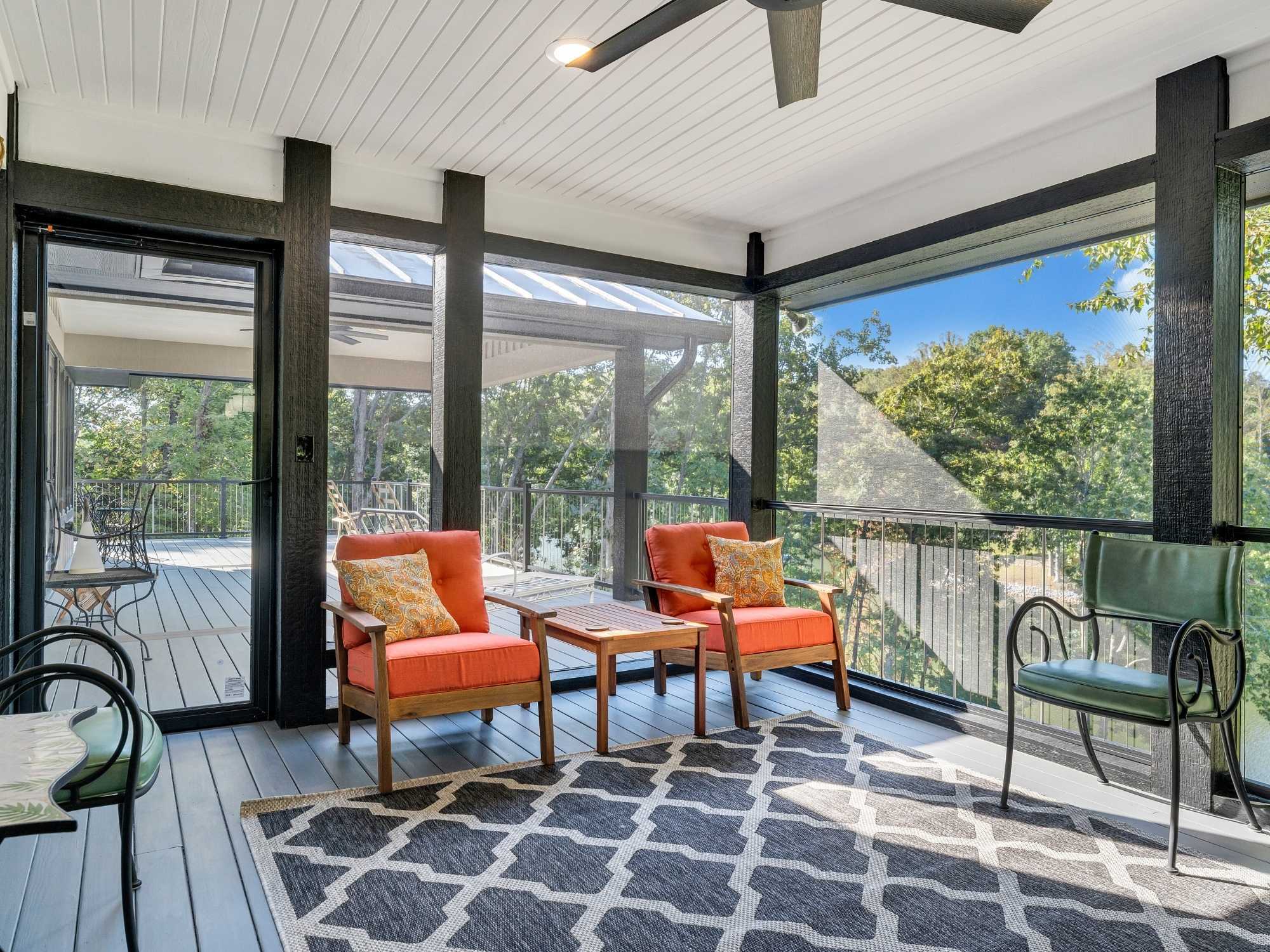 Second-story screen enclosed lounging area in the home addition by Grace Alon Builders