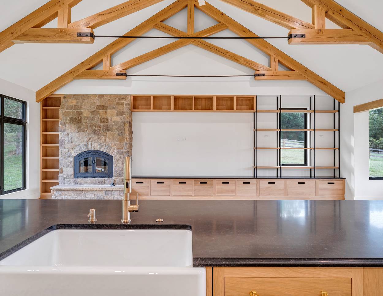 Open-concept living area with a fireplace in a custom home by Grace Alon Builders in Roanoke, VA